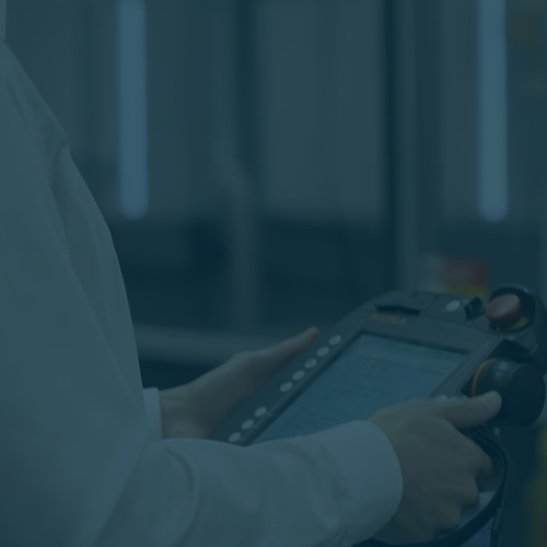 Person holding tablet that controls robots